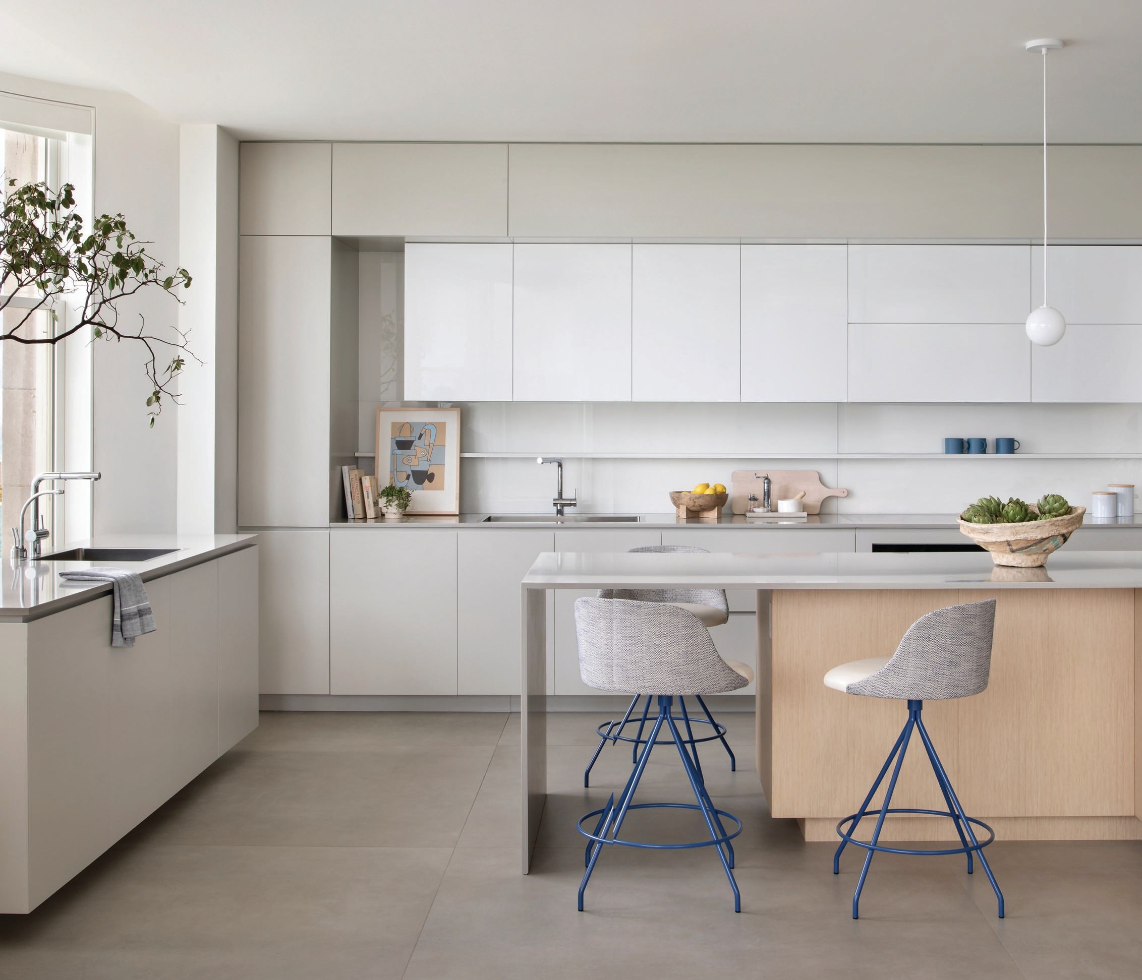 Stone Italiana countertops in Cartapietra Greige and cabinetry by Peter Chasak set a soothing, stylish tone in the kitchen Photographed by Gibeon Photography
