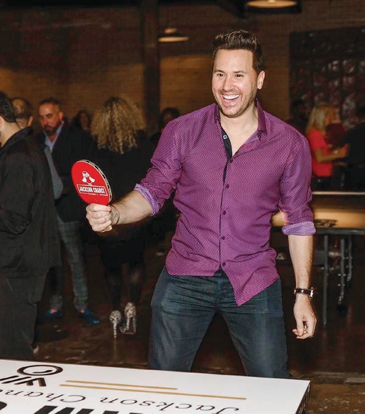 Ryan Chiaverini of ABC 7 gets into the swing of things at the Jackson Chance Foundation Ping Pong Ball 2022. PHOTO BY STEPHANIE JENSEN