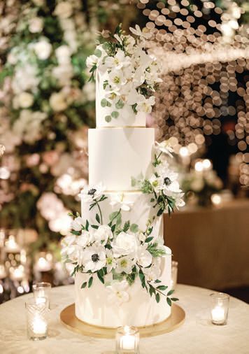 A wedding cake but loved working with Bria at Flourish Cake Design. “The cake was a work of art, and she is a master of the sugar flower craft,” Amy says