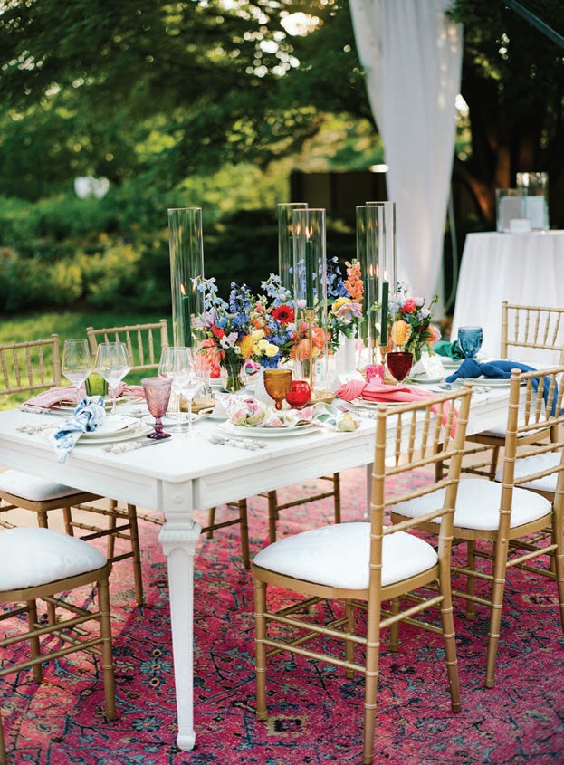 Centerpiece florals included delphiniums and dahlias Photographed by Liz Banfield