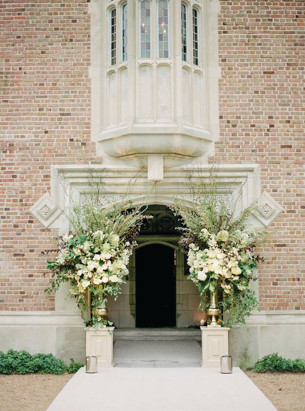 Floral arrangements flanked the entrance Photographed by Olivia Leigh Photographie