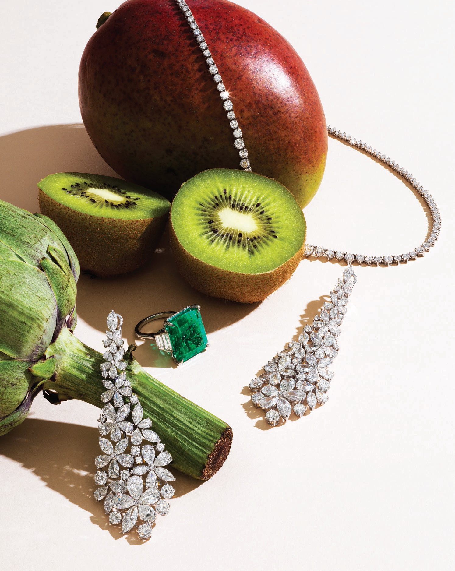 From top: Kwiat Riviera diamond necklace and emerald and diamond ring, kwiat.com; Graff Carissa collection earrings featuring 42.34 carats of diamonds set in white gold, graff.com. Photographed by BRIAN KLUTCH Styled by FAYE POWER VANDE VREDE