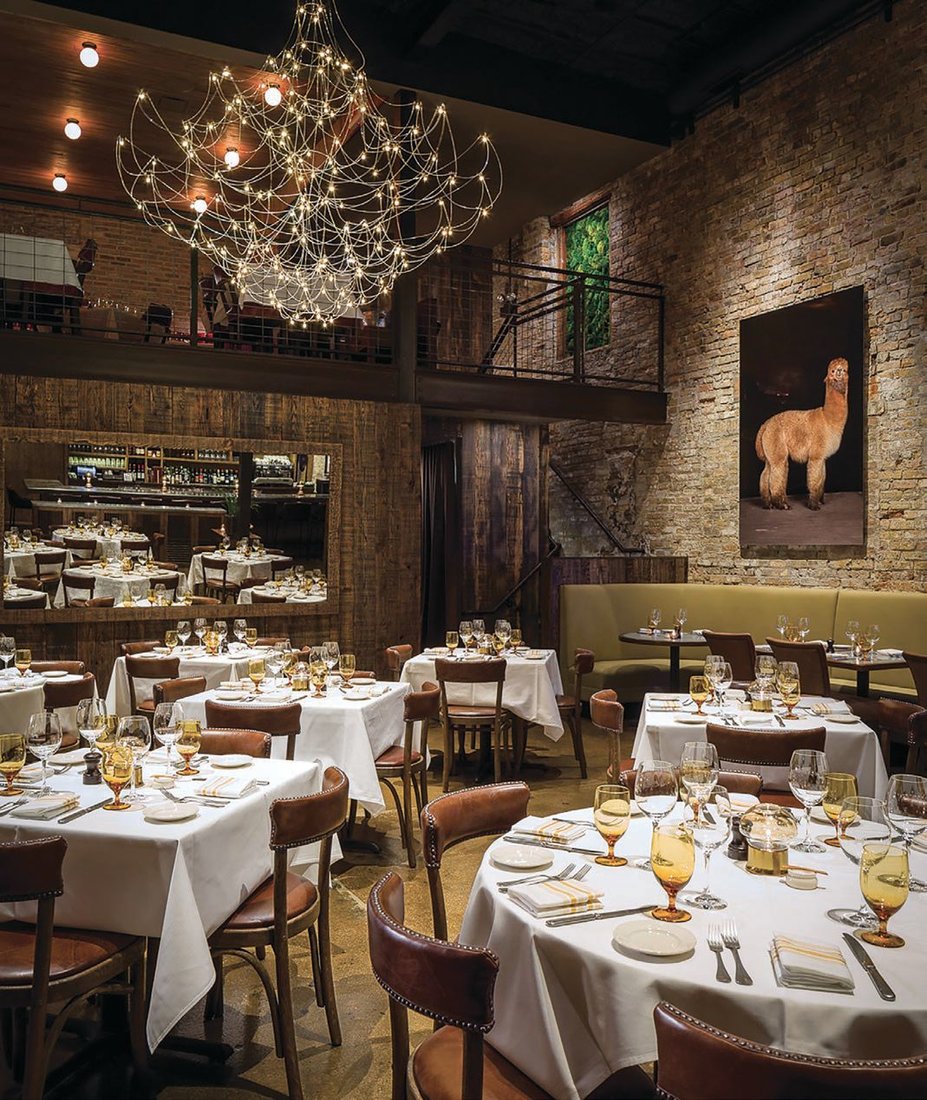 The rustic-chic main dining room at The Barn Steakhouse. PHOTO BY GALDONES PHOTOGRAPHY