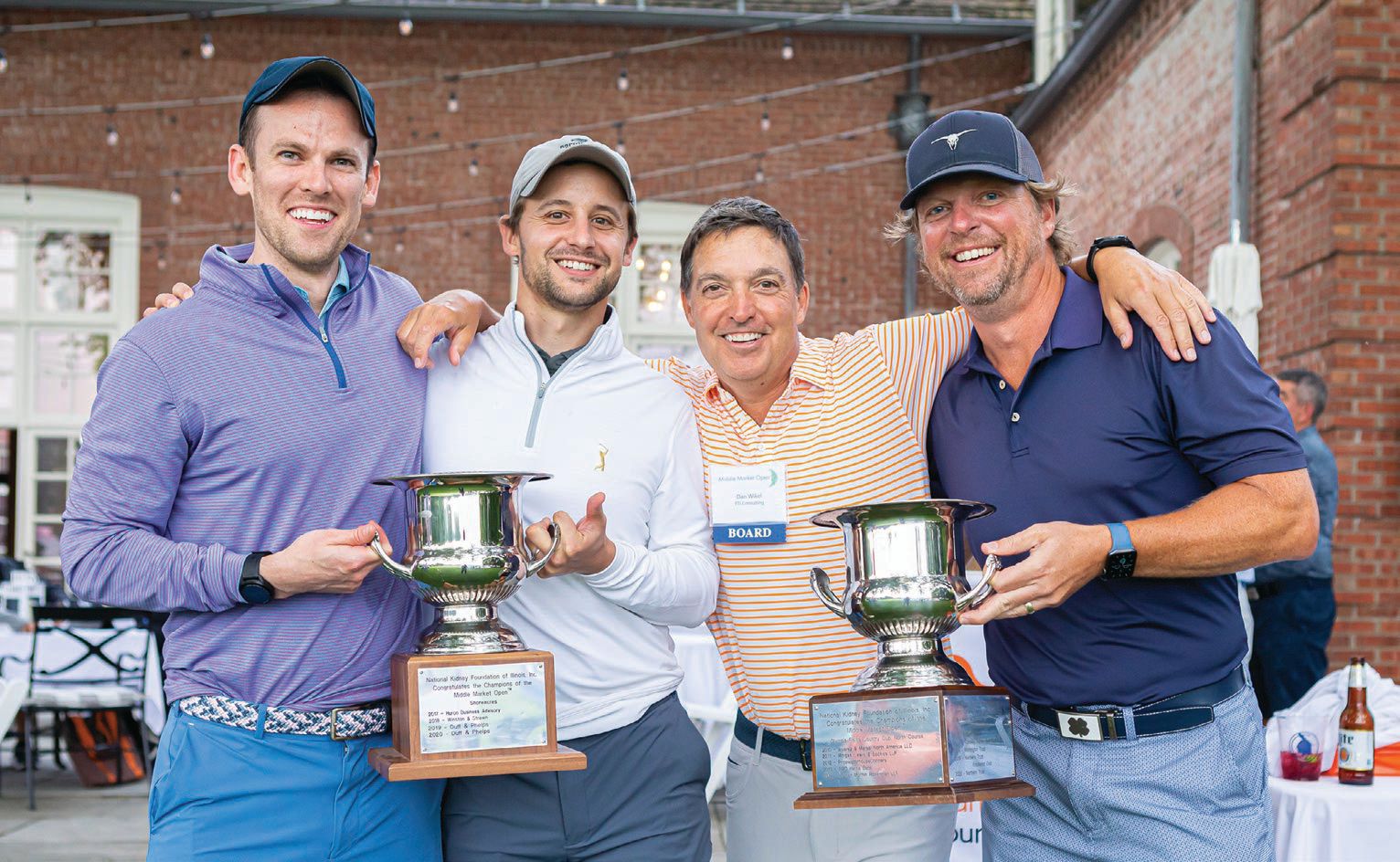 From left: Dan Miles, Sam Domjen, Dan Wikel and Matt Murphy celebrate their victory in the National Kidney Foundation of Illinois’ 2021 Middle Market Open golf tourney. PHOTO BY NANCY WONG