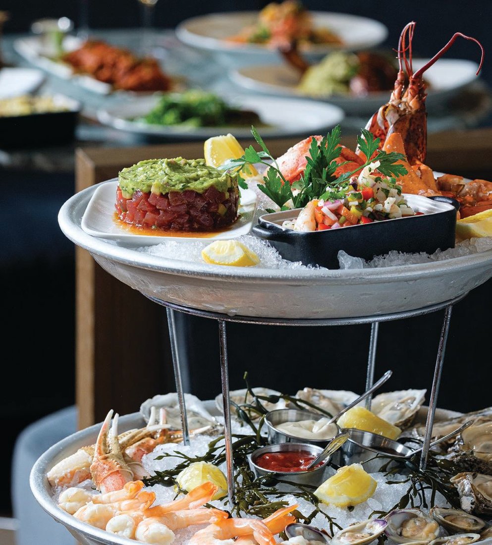 At Lure Fishbar, a shellfish plateau beckons with oysters, shrimp, clams, crab claws, tuna tartare and seafood salad. PHOTO: BY GALDONES PHOTOGRAPHY