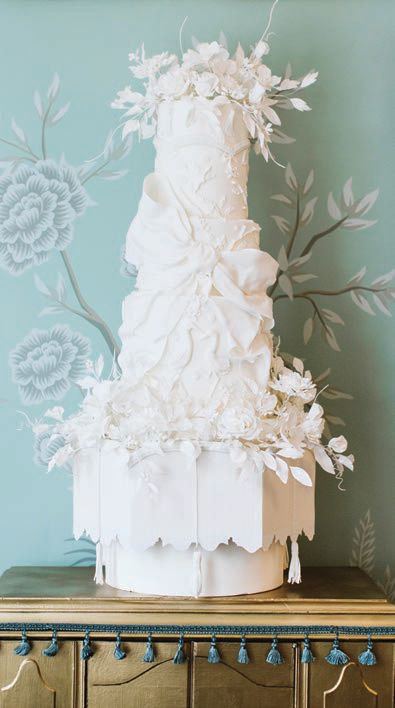 The cake was a work of art, with architectural motifs pulled from the venue and sugar tassels that moved Photographed by True Grace Photography