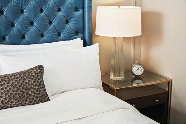 Guest rooms are appointed with contemporary furnishings and selects such as an analog clock in a nod to the property’s historic roots PHOTO COURTESY OF THE LYTLE PARK HOTEL