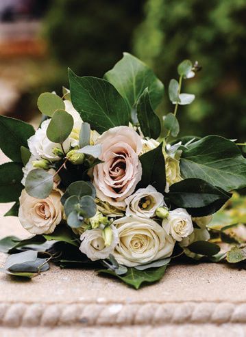 Lindsey’s bouquet featured white lisianthus, white and black anemones, champagne roses, peach ranunculus and more