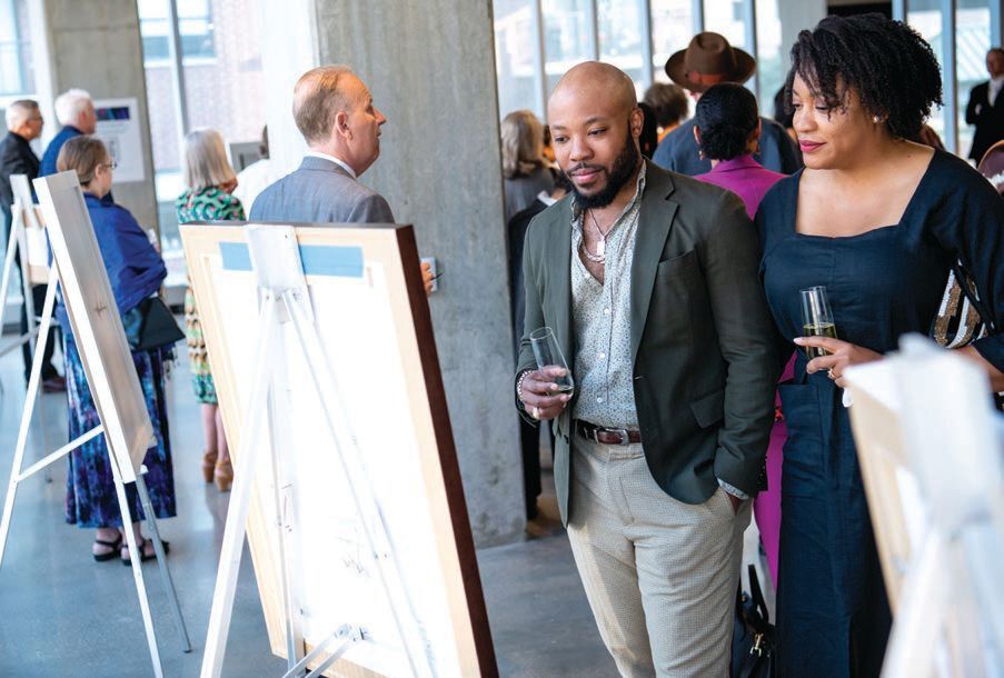 Guests browsed works at a VIP reception. PHOTO: BY JULIE LUCAS