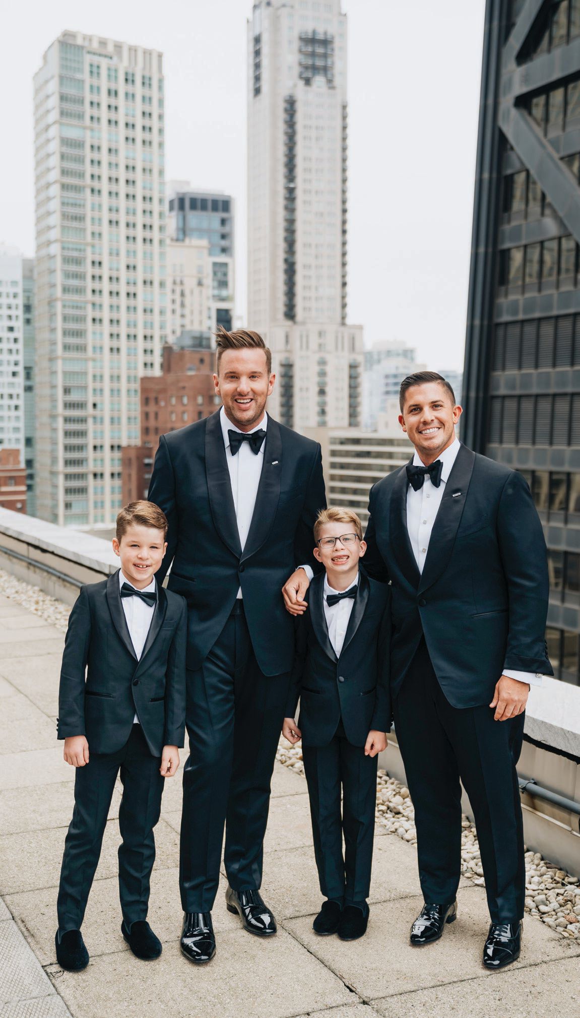 The grooms with their 8-year-old twin sons.