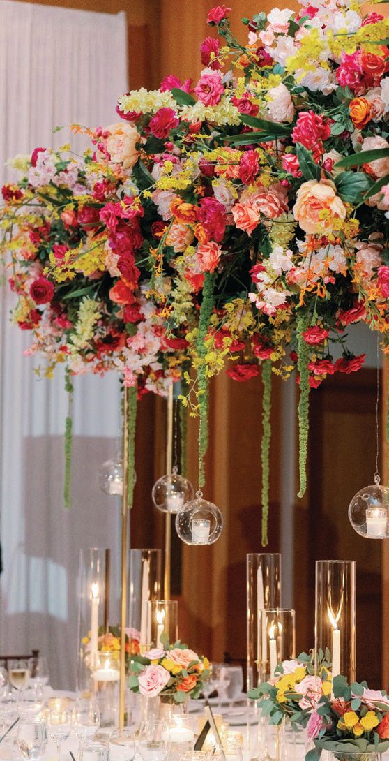 Tropical-inspired floral centerpieces with floating candles
