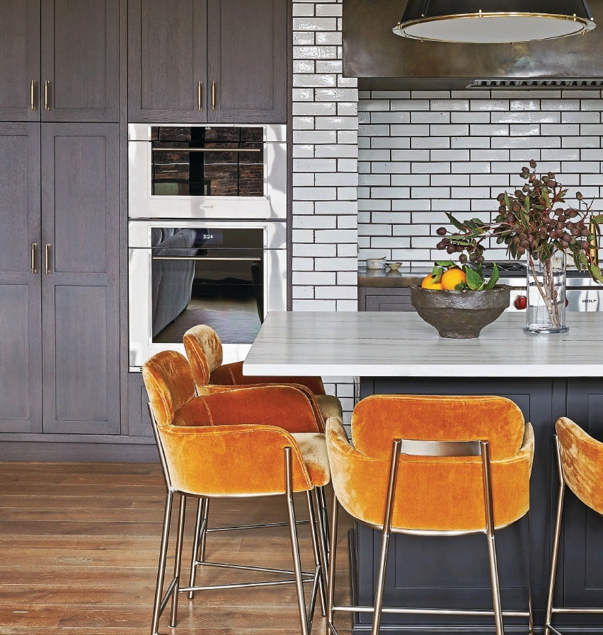 CB2 Azalea counter stools in champagne pop in the kitchen. Photographed by Anthony Tahlier