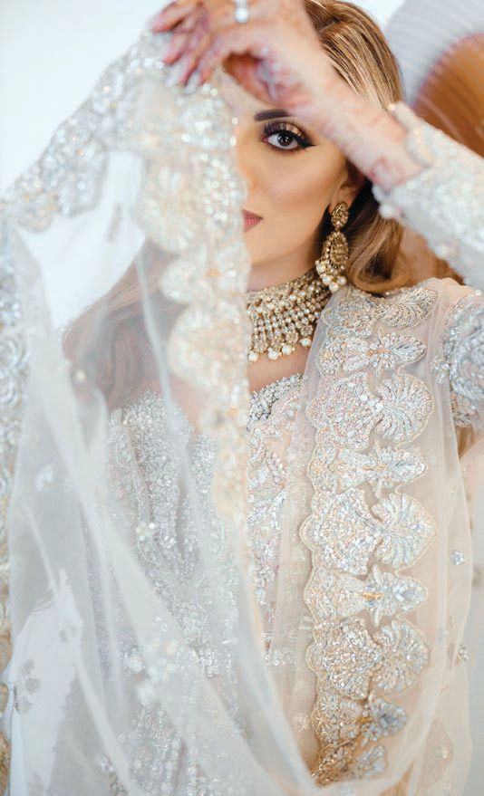 The bride’s intricate beaded gown was designed in Pakistan Photographed by IVASH Photography