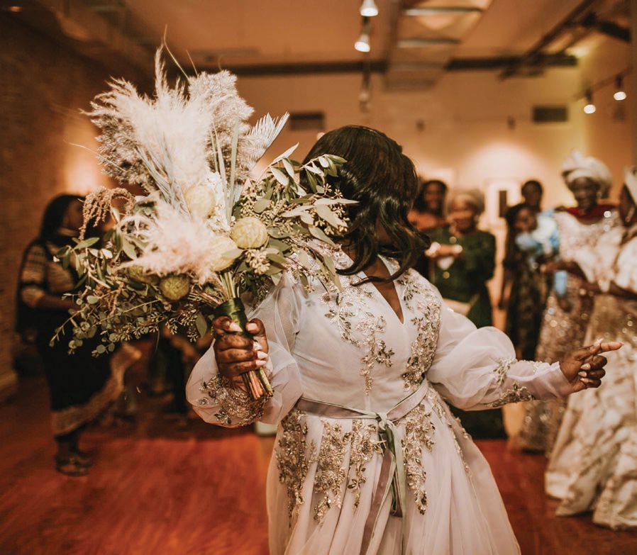 For the reception (and bouquet toss!) Rahamat changed into an embellished dress by Teuta Matoshi Photographed by Gabrielle Daylor Photography