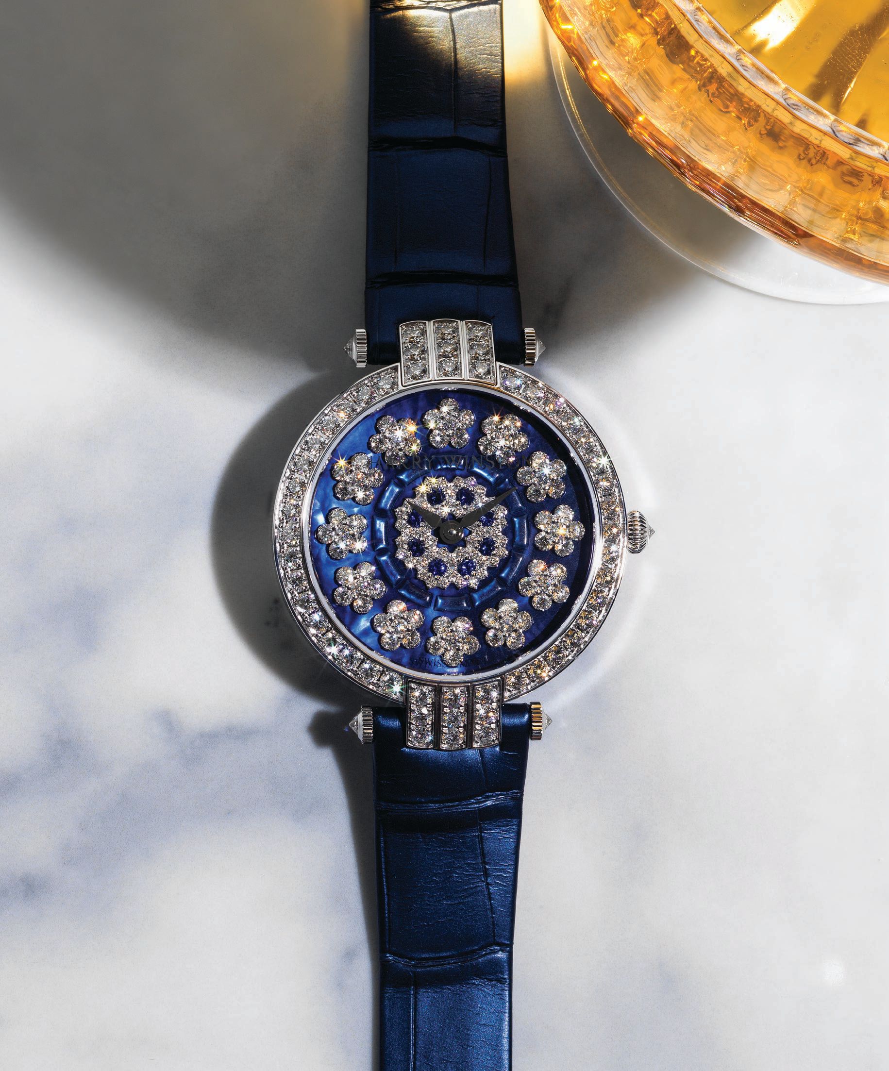 Harry Winston Premier Sunflower timepiece featuring diamonds set in 18K white gold, harrywinston.com PHOTOGRAPHED BY BRIAN KLUTCH STYLED BY FAYE POWER VANDE VREDE