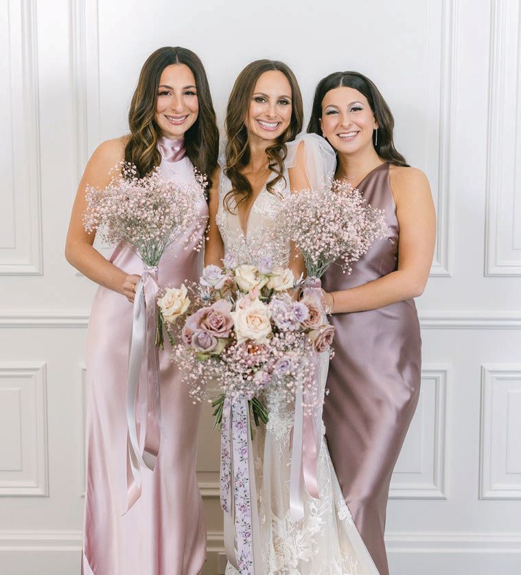 Bridesmaids’ gowns were by different designers but blended together seamlessly Photographed by Tim Tab Studios