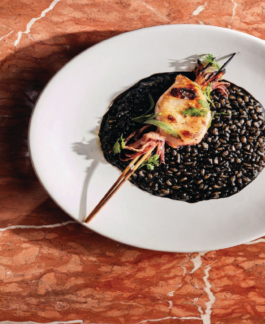 The crni risotto at Rose Mary comes with squid ink, lobster brodo, confit squid and tarragon. PHOTO BY MATT HAAS