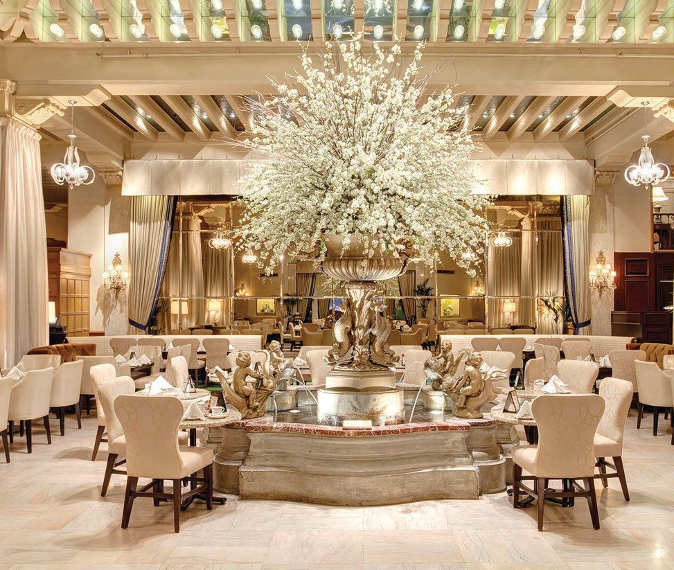 the stunning Palm Court of Th e Drake.