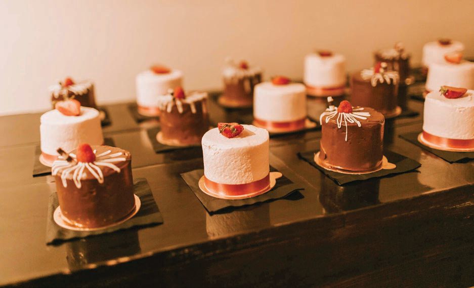 Guests enjoyed individual mini cakes in an assortment of flavors from Bombon Photographed by Gabrielle Daylor Photography