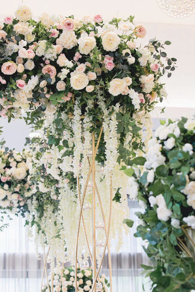 The ceremony decor was light and ethereal Photographed by Soda Fountain Photography