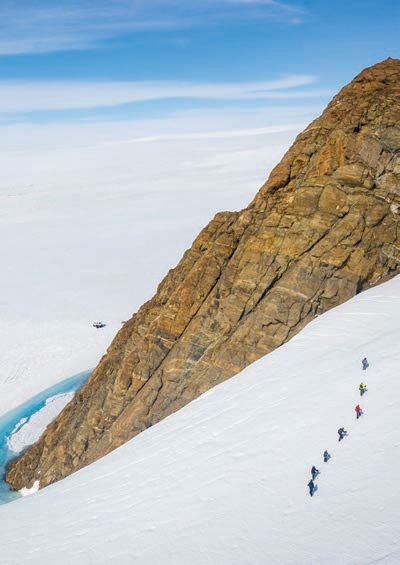 A group treks across the Antarctic tundra PHOTO COURTESY OF: WHITE DESERT ANTARCTICA/RED SAVANNAH