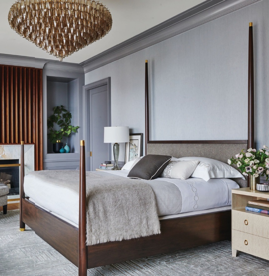 In the primary bedroom, RH's Chiara smoke glass chandelier hangs above a custom-designed bed Photographed by Richard Powers