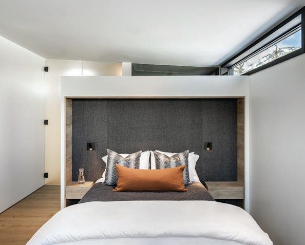 A custom bed by the design team in the guest bedroom. PHOTOGRAPHED BY DRAPER WHITE