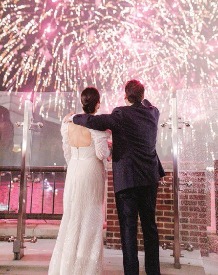 Fireworks exploded over Navy Pier—and even matched the wedding’s color palette!—during the reception Photographed by Connie Marina Photography