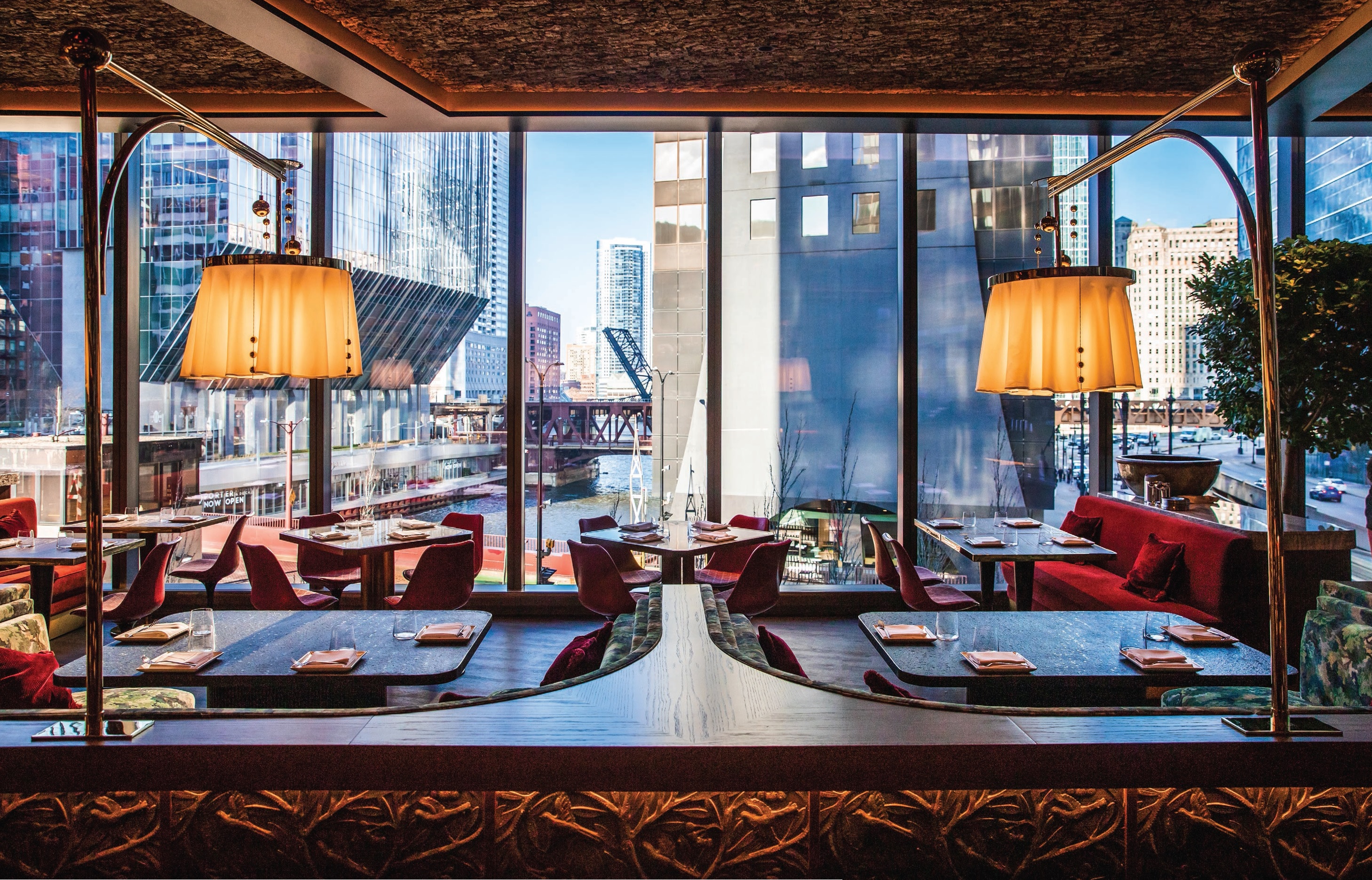 Bazaar Meat’s sultry second-floor dining room beckons with picturesque river views PHOTO BY: GARRETT SWEET
