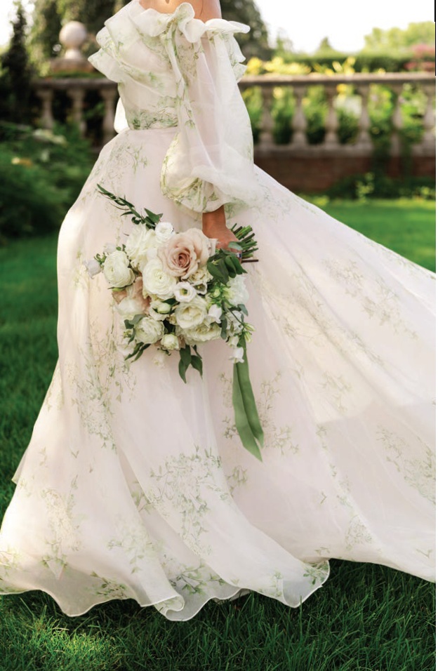 Annie’s Monique Lhuillier gown was ethereal in the garden setting Photographed by Liz Banfield