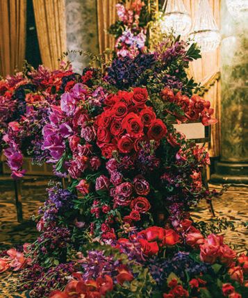 Deeppurple and red florals made up extravagant arrangements Photographed by Caroline Ghetes