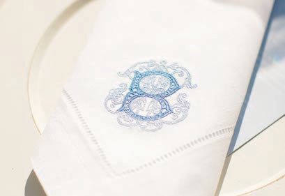 The couple’s custom monogram featured on napkins and other decor elements Photographed by Rachael Kazmier Photography