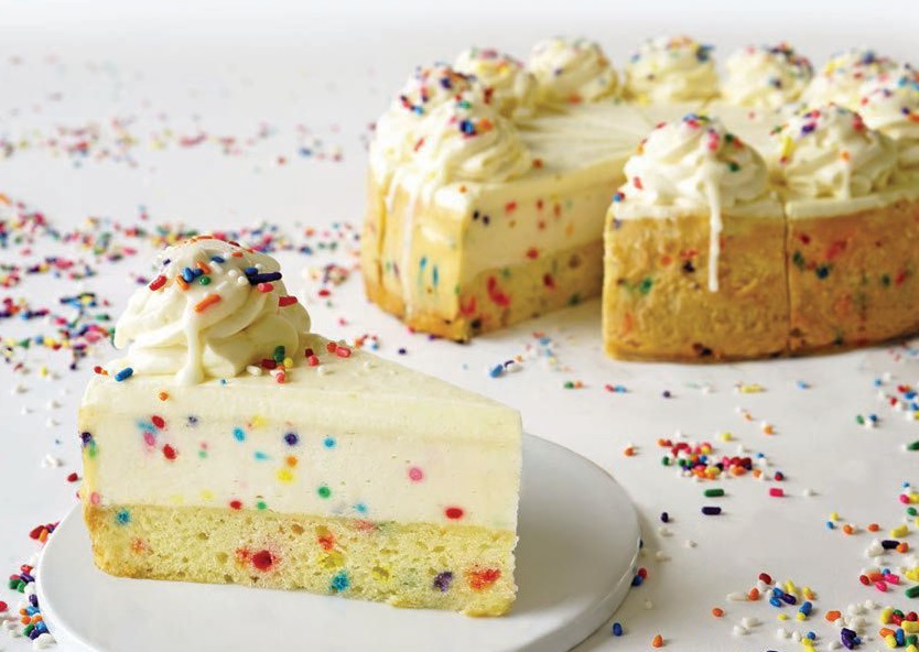 Eli’s Cheesecake’s confetti cheesecake—a 2021 Fabi Award winner—which boasts housemade yellow confetti cake topped with a layer of birthday cake confetti cheesecake, handpiped vanilla mousse and more sprinkles. COURTESY OF ELI’S CHEESECAKE